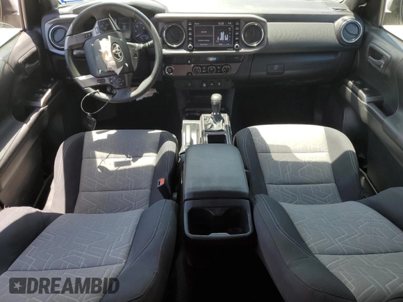 2023 Toyota Tacoma SR5 z VIN 3TMAZ5CN2PM217085, wystawiony jako Copart lot #53563675 z przebiegiem 7 389 mil mil oraz Szkoda całkowita • Salvage title. Historia ofert i sprzedaży dostępna na DreamBid. Obrazek 8.
