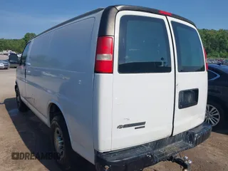 2014 Chevrolet Express Cargo Van with VIN 1GCWGFCG0E1100859, listed as a IAAI auction lot 42142748 with 182,900 mi miles. Bid and sale history available at carsss.com. Image 3.
