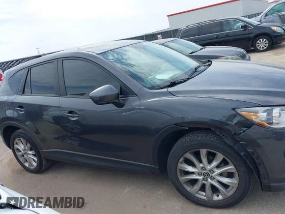 2014 Mazda CX-5 Grand Touring with VIN JM3KE2DY0E0354220, listed as a IAAI auction lot 41885502 with 168,901 mi miles. Bid and sale history available at carsss.com. Image 13.