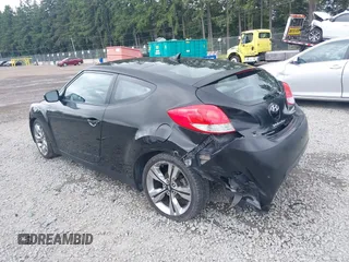 2012 Hyundai Veloster w/Gray Int with VIN KMHTC6AD4CU062034, listed as a IAAI auction lot 42371790 with 116,861 mi miles and . Bid and sale history available at DreamBid. Image 3.