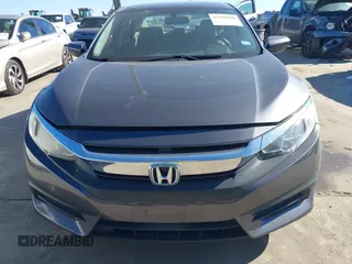 2017 Honda Civic LX z VIN 19XFC2F58HE012626, wystawiony jako IAAI lot #41458898 z przebiegiem 120 354 mil mil oraz . Historia ofert i sprzedaży dostępna na DreamBid. Obrazek 12.