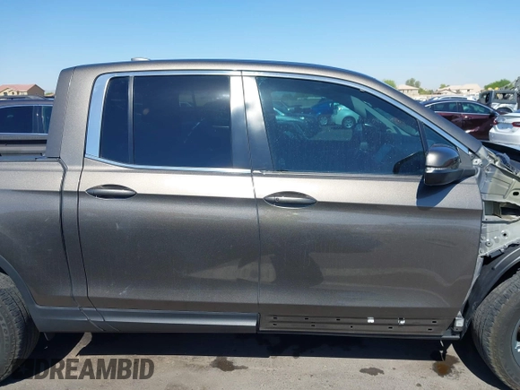 2022 Honda Ridgeline RTL with VIN 5FPYK3F58NB007618, listed as a IAAI auction lot 42258443 with 14,036 mi miles and . Bid and sale history available at DreamBid. Image 14.