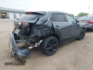 2023 Mazda CX-30 S Carbon Edition with VIN 3MVDMBCM4PM577619, listed as a IAAI auction lot 42219801 with 24,784 mi miles and . Bid and sale history available at DreamBid. Image 4.