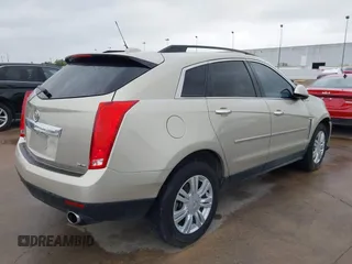 2015 Cadillac SRX z VIN 3GYFNAE37FS597695, wystawiony jako IAAI lot #42184666 z przebiegiem 106 210 mil mil oraz . Historia ofert i sprzedaży dostępna na DreamBid. Obrazek 4.