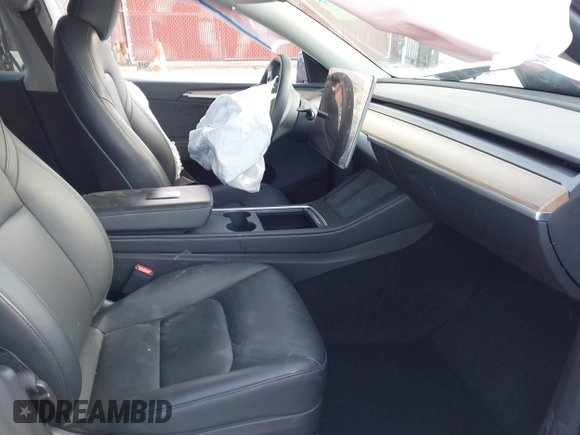2023 Tesla Model Y Long Range with VIN 7SAYGDEE7PA192488, listed as a IAAI auction lot 42233466 with Not provided miles and . Bid and sale history available at DreamBid. Image 5.