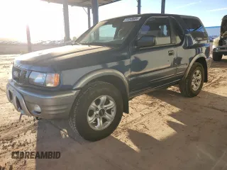 2002 Isuzu Rodeo z VIN 4S2CK57W524323684, wystawiony jako Copart lot #77248604 z przebiegiem 157 970 mil mil oraz Tytuł czysty. Historia ofert i sprzedaży dostępna na DreamBid. Obrazek 1.
