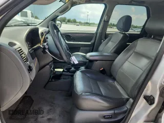 2003 Ford Escape XLT Popular with VIN 1FMYU03103KA06199, listed as a Copart auction lot 58731515 with 181,429 mi miles and Salvage title. Bid and sale history available at DreamBid. Image 7.
