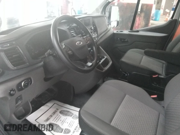 2023 Ford Transit Cargo z VIN 1FTBR1X86PKC02291, wystawiony jako IAAI lot #42791621 z przebiegiem 32 389 mil mil oraz . Historia ofert i sprzedaży dostępna na DreamBid. Obrazek 8.