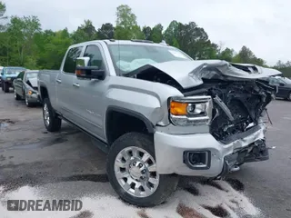 2019 GMC Sierra 2500HD Denali with VIN 1GT12SEY4KF243612, listed as a IAAI auction lot 41962727 with 71,936 mi miles. Bid and sale history available at carsss.com. Image 1.