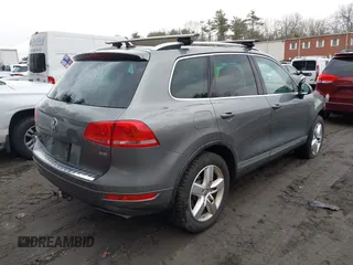2013 Volkswagen Touareg Lux with VIN WVGEF9BP0DD005082, listed as a IAAI auction lot 41667026 with 140,148 mi miles and . Bid and sale history available at DreamBid. Image 4.