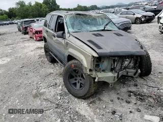 1996 Jeep Grand Cherokee Laredo with VIN 1J4GZ58S3TC297818, listed as a Copart auction lot 67712584 with 284,653 mi miles and Salvage Title. Bid and sale history available at carsss.com. Image 12.