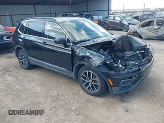 2021 Volkswagen Tiguan SE with VIN 3VV3B7AX3MM157702, listed as a IAAI auction lot 41888479 with 51,807 mi miles and . Bid and sale history available at DreamBid. Image 1.