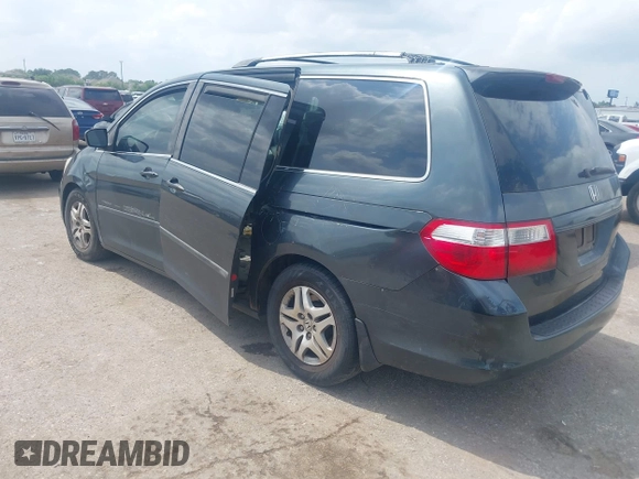 2006 Honda Odyssey LX with VIN 5FNRL38206B120381, listed as a IAAI auction lot 42058872 with 165,217 mi miles. Bid and sale history available at carsss.com. Image 3.