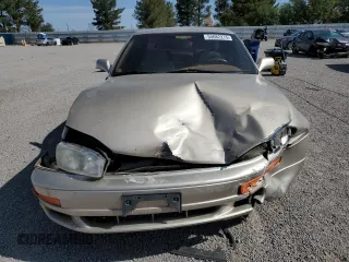 1993 Toyota Camry LE z VIN 4T1SK12E7PU287093, wystawiony jako Copart lot #55682275 z przebiegiem 110 399 mil mil oraz Szkoda całkowita • Salvage title. Historia ofert i sprzedaży dostępna na DreamBid. Obrazek 5.