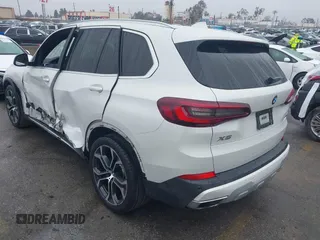 2021 BMW X5 sDrive40i with VIN 5UXCR4C03M9F24817, listed as a IAAI auction lot 41512172 with 54,867 mi miles. Bid and sale history available at carsss.com. Image 3.