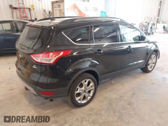 2014 Ford Escape SE with VIN 1FMCU9G95EUA16328, listed as a IAAI auction lot 42464235 with 108,570 mi miles and . Bid and sale history available at DreamBid. Image 4.