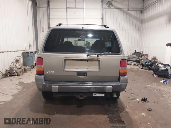 1996 Jeep Grand Cherokee Laredo with VIN 1J4GZ58S5TC182766, listed as a IAAI auction lot 41372356 with 234,390 mi miles. Bid and sale history available at carsss.com. Image 17.