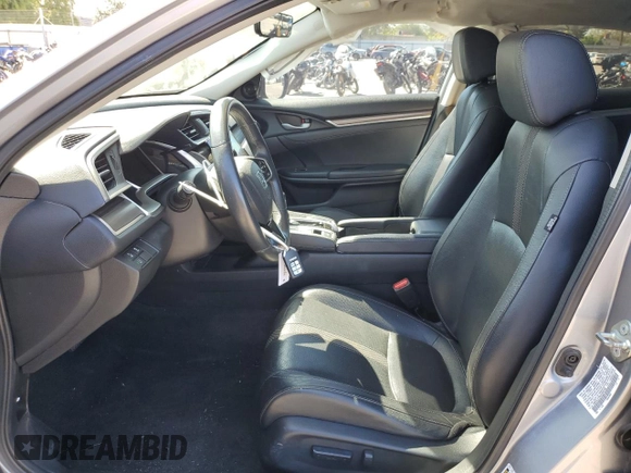 2020 Honda Civic EX-L z VIN 19XFC1F70LE209746, wystawiony jako Copart lot #52141315 z przebiegiem 84 387 mil mil oraz Szkoda całkowita • Salvage title. Historia ofert i sprzedaży dostępna na DreamBid. Obrazek 7.
