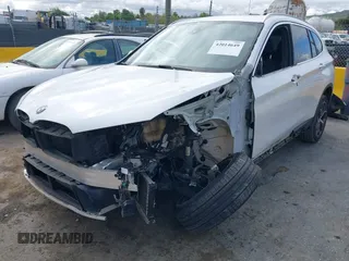 2018 BMW X1 sDrive28i with VIN WBXHU7C38J5L05985, listed as a IAAI auction lot 42014649 with 77,082 mi miles. Bid and sale history available at carsss.com. Image 6.