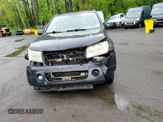2006 Suzuki Grand Vitara Luxury with VIN JS3TD947364101307, listed as a Copart auction lot 55037585 with 198,616 mi miles and Salvage title. Bid and sale history available at DreamBid. Image 15.