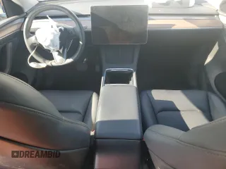2024 Tesla Model Y with VIN 7SAYGDED1RF212974, listed as a Copart auction lot 44776005 with 16,841 mi miles and Salvage Title. Bid and sale history available at DreamBid. Image 8.