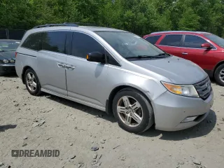 2012 Honda Odyssey Touring with VIN 5FNRL5H93CB121366, listed as a Copart auction lot 55383885 with 197,885 mi miles and Salvage title. Bid and sale history available at DreamBid. Image 4.