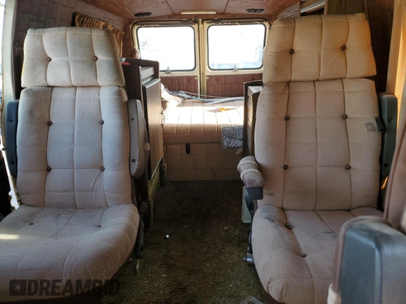 1979 GMC Vandura z VIN TGR2597506100, wystawiony jako Copart lot #51086615 z przebiegiem 25 002 mil mil oraz Tytuł czysty. Historia ofert i sprzedaży dostępna na DreamBid. Obrazek 10.