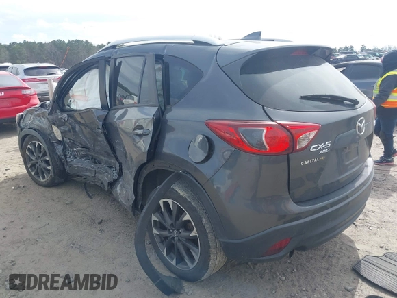 2016 Mazda CX-5 Grand Touring with VIN JM3KE4DY9G0845707, listed as a IAAI auction lot 41709685 with 96,351 mi miles. Bid and sale history available at carsss.com. Image 3.