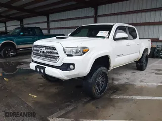2016 Toyota Tacoma SR with VIN 5TFCZ5AN3GX039919, listed as a IAAI auction lot 41607382 with 107,703 mi miles. Bid and sale history available at carsss.com. Image 2.