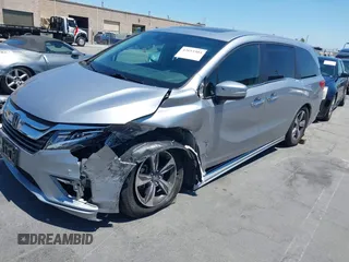2018 Honda Odyssey Touring with VIN 5FNRL6H81JB022975, listed as a IAAI auction lot 42653304 with 210,137 mi miles and . Bid and sale history available at DreamBid. Image 18.
