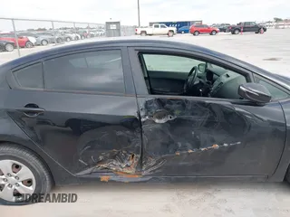 2016 Kia Forte LX with VIN KNAFX4A64G5499881, listed as a IAAI auction lot 42068921 with 122,596 mi miles. Bid and sale history available at carsss.com. Image 6.
