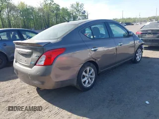 2014 Nissan Versa SV with VIN 3N1CN7AP2EL877539, listed as a IAAI auction lot 42107642 with 122,616 mi miles. Bid and sale history available at carsss.com. Image 4.