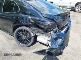 2022 Toyota Camry TRD with VIN 4T1KZ1AK2NU064511, listed as a IAAI auction lot 42176608 with 28,064 mi miles and . Bid and sale history available at DreamBid. Image 6.