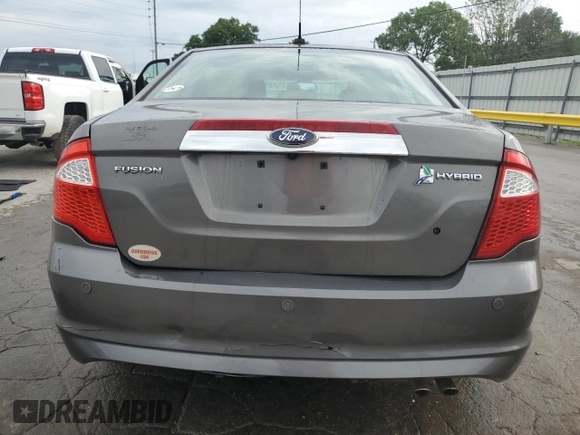 2012 Ford Fusion Hybrid z VIN 3FADP0L33CR211609, wystawiony jako Copart lot #60873005 z przebiegiem 144 474 mil mil oraz Szkoda całkowita • Salvage title. Historia ofert i sprzedaży dostępna na DreamBid. Obrazek 6.