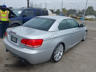 2010 BMW 3 Series 335i with VIN WBAWL7C53AP474127, listed as a IAAI auction lot 41871518 with 111,136 mi miles. Bid and sale history available at carsss.com. Image 4.