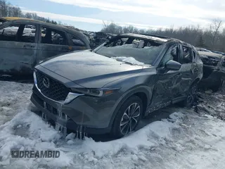 2023 Mazda CX-5 2.5 S Premium Package with VIN JM3KFBDM5P0267412, listed as a IAAI auction lot 40351716 with 7,306 mi miles. Bid and sale history available at carsss.com. Image 2.