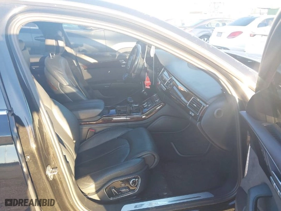 2016 Audi A8 L 3.0T with VIN WAU34AFD9GN007007, listed as a IAAI auction lot 41770501 with 114,987 mi miles. Bid and sale history available at carsss.com. Image 5.