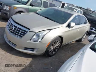 2013 Cadillac XTS Premium z VIN 2G61S5S35D9143656, wystawiony jako IAAI lot #42099511 z przebiegiem 207 055 mil mil oraz . Historia ofert i sprzedaży dostępna na DreamBid. Obrazek 2.
