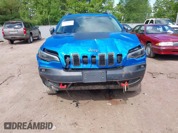 2020 Jeep Cherokee Trailhawk with VIN 1C4PJMBXXLD636547, listed as a IAAI auction lot 42314654 with 59,061 mi miles and . Bid and sale history available at DreamBid. Image 6.
