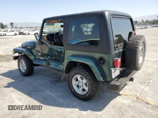 2000 Jeep Wrangler Sahara z VIN 1J4FA59S1YP746043, wystawiony jako Copart lot #58842665 z przebiegiem 148 348 mil mil oraz Szkoda całkowita • Salvage title. Historia ofert i sprzedaży dostępna na DreamBid. Obrazek 2.
