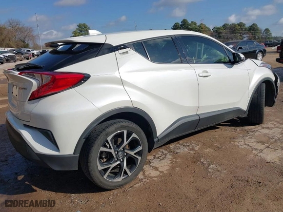 2019 Toyota C-HR XLE with VIN JTNKHMBX2K1041838, listed as a IAAI auction lot 41511513 with 107,145 mi miles. Bid and sale history available at carsss.com. Image 4.
