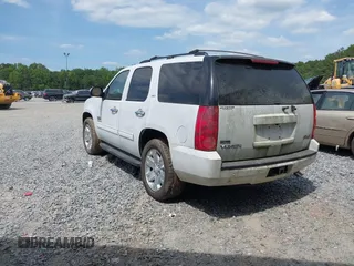 2011 GMC Yukon SLT with VIN 1GKS1CE0XBR156954, listed as a IAAI auction lot 42096120 with 288,142 mi miles. Bid and sale history available at carsss.com. Image 3.