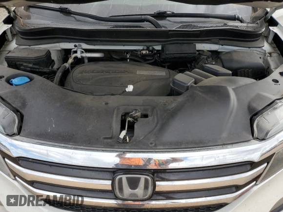 2017 Honda Pilot Touring z VIN 5FNYF6H92HB067140, wystawiony jako Copart lot #72200584 z przebiegiem 127 856 mil mil oraz Szkoda całkowita • Salvage title. Historia ofert i sprzedaży dostępna na DreamBid. Obrazek 14.