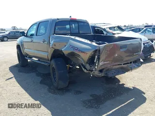 2015 Toyota Tacoma PreRunner with VIN 3TMJU4GN8FM185826, listed as a IAAI auction lot 42181952 with 229,936 mi miles and . Bid and sale history available at DreamBid. Image 3.