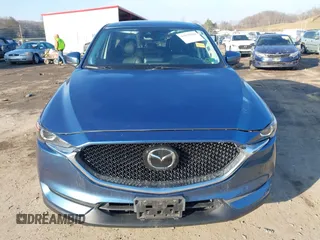 2018 Mazda CX-5 Touring z VIN JM3KFBCM2J0461954, wystawiony jako IAAI lot #41655865 z przebiegiem 129 333 mil mil oraz . Historia ofert i sprzedaży dostępna na DreamBid. Obrazek 11.
