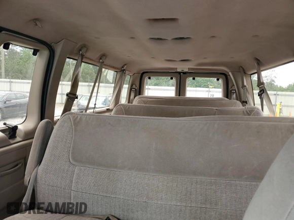 1992 Ford Econoline Wagon Super Custom z VIN 1FBJS31H3NHB08839, wystawiony jako Copart lot #55049275 z przebiegiem 158 054 mil mil oraz Szkody całkowita. Historia ofert i sprzedaży dostępna na DreamBid. Obrazek 10.