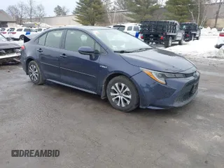 2021 Toyota Corolla Hybrid LE with VIN JTDEAMDE2MJ030035, listed as a IAAI auction lot 41644662 with 130,693 mi miles. Bid and sale history available at carsss.com. Image 1.