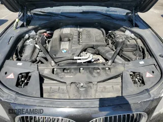 2012 BMW 7 Series 740i with VIN WBAKA4C59CDS99437, listed as a Copart auction lot 73795104 with 120,199 mi miles and Clean Title. Bid and sale history available at carsss.com. Image 11.