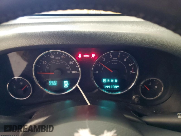 2015 Jeep Wrangler Unlimited Freedom with VIN 1C4BJWDG5FL713046, listed as a Copart auction lot 58563455 with 144,179 mi miles and Salvage title. Bid and sale history available at DreamBid. Image 9.