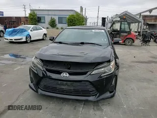 2015 Scion tC z VIN JTKJF5C75F3093123, wystawiony jako Copart lot #58414325 z przebiegiem 107 051 mil mil oraz Szkoda całkowita • Salvage title. Historia ofert i sprzedaży dostępna na DreamBid. Obrazek 13.